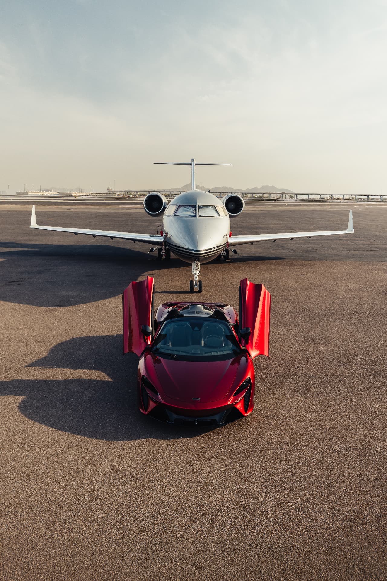 McLaren Artura Spider staged nose-to-nose with a private jet in Scottsdale