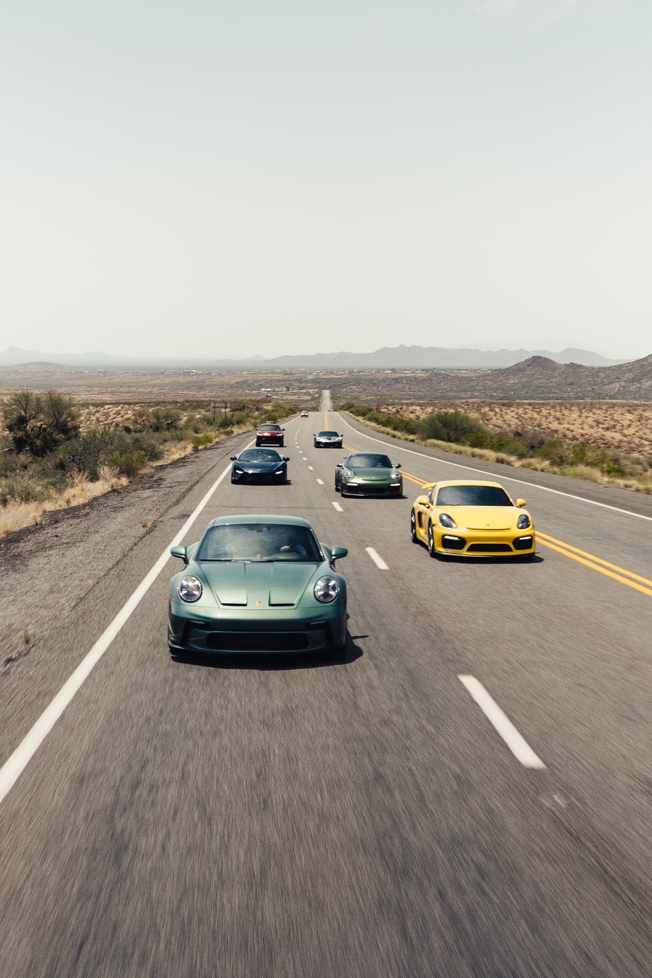 The rally pack running desert two-lane out of Scottsdale