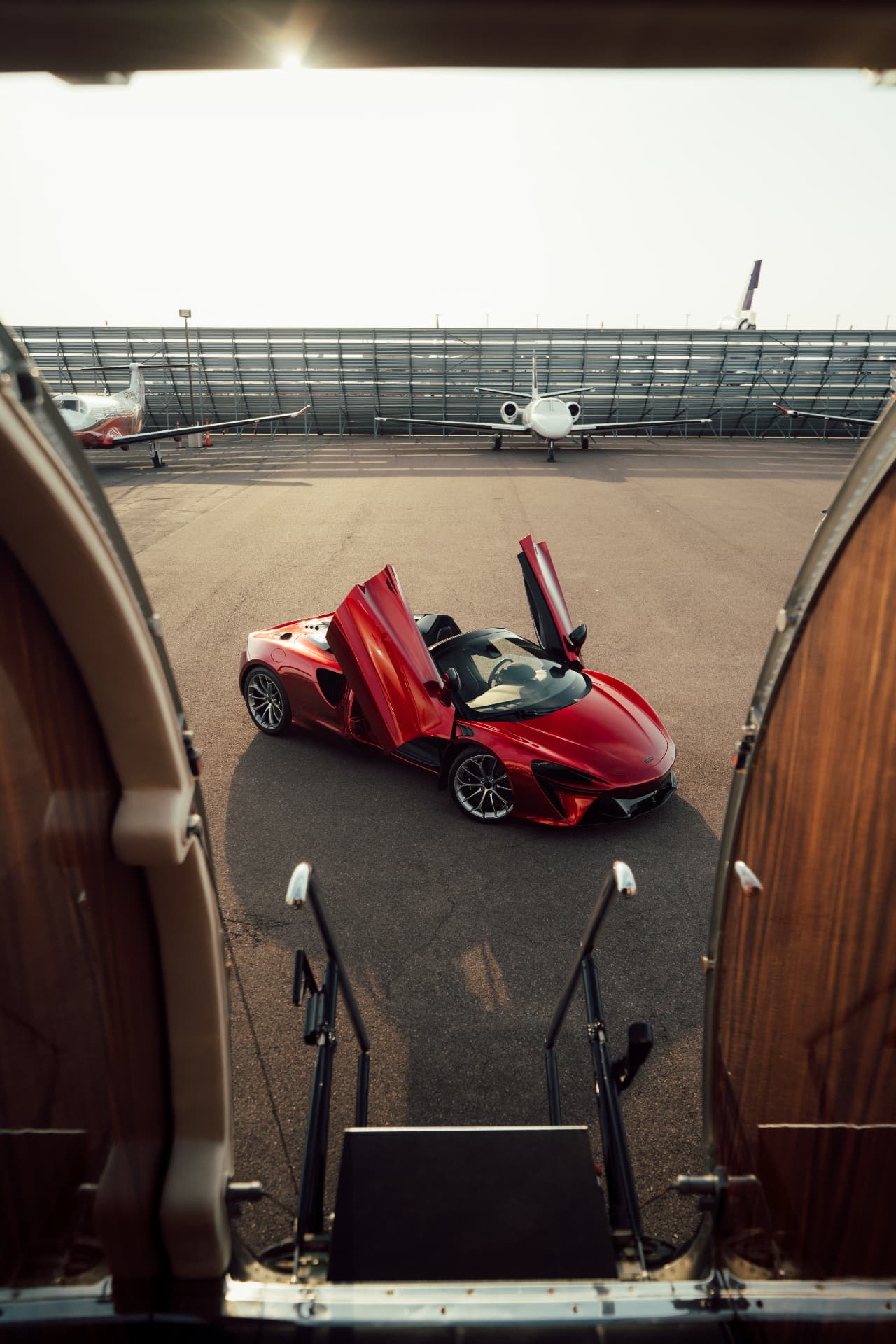 McLaren Artura Spider staged on the ramp seen from the jet's airstair